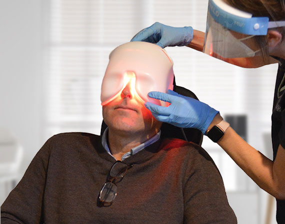 Patient receiving low-level light therapy