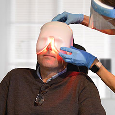 Man having a TRS-6100 eye exam